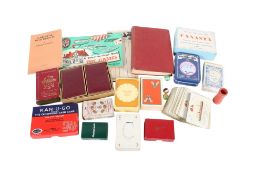 A collection of assorted playing card games and instruction books.
