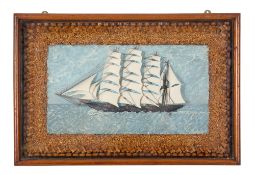A diorama of a three masted ship under sail.