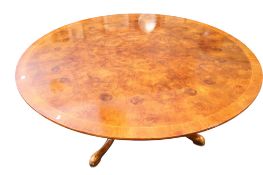 A Victorian style round mahogany veneer pedestal dining table.