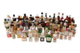 A collection of assorted bottles of miniatures. Mostly rum and gin, etc.