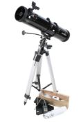 A Sky-Watcher reflector astronomical telescope with tripod.