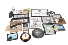 Collection of assorted Guinness related advertising items.