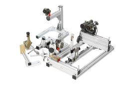 A collimator, binocular lens and prism realigning and checking testing rig.