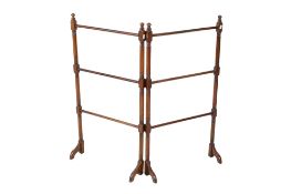 An Edwardian mahogany clothes horse stand. Raised on turned supports.