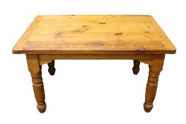 Pine kitchen table. Raised on turned baluster supports.