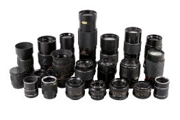 A collection of assorted vintage SLR camera lenses.