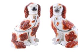 A pair of Staffordshire pottery King Charles Spaniels.