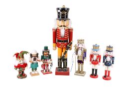 A collection of seven wooden soldiers designed as nutcrackers. Max.