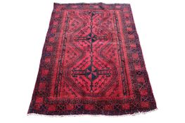 A large red ground rug, handmade in Tabriz.