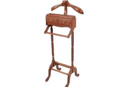 A contemporary gentleman's valet stand. Raised on twist carved supports united by stretcher.