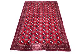 A red ground rug, handmade in Tabriz.
