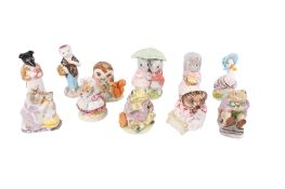 A collection of eleven assorted Beswick Beatrix Potter character figures.
