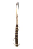 Two assorted tribal spears in a bark quiver. Max.