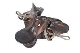 An Albion brown leather horse riding saddle. With stirrups.