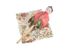 A vintage musical jester doll.