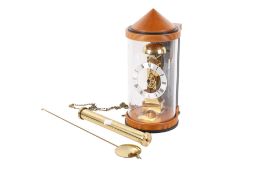 A retro Hermle weight driven pendulum wall clock.