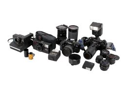 Collection of assorted film cameras and accessories.