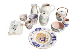 A collection of assorted mid-century Poole Pottery. Including a cheese dish and cover, jugs, etc.