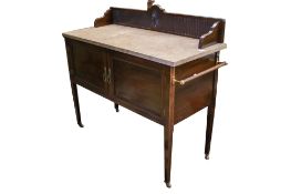 An Edwardian mahogany marble top wash stand.