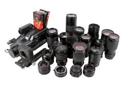 Collection of assorted SLR camera lenses and a VHS video camera outfit.