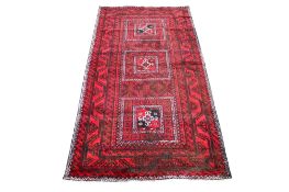 A large red ground rug, handmade in Tabriz.