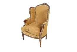 A French style gilt frame wingback lounge chair.
