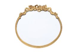 A circular gilt framed wall mirror. Having applied decoration.