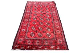 A large deep red ground handmade rug, Shiraz, Kurosh.
