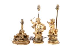 Pair of gilt musical cherub table lamps and another. Max. H26cm. (3).