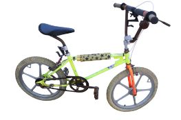 A vintage BMX bicycle with a yellow frame and plastic spoke wheels.