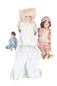 Two vintage German dolls and a papier mache doll.