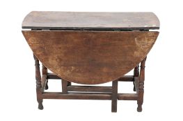 Antique oak gateleg dining table.