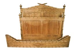 A carved pine 4ft bed frame.