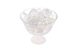 Collection of assorted glass decanter stoppers in a bowl.