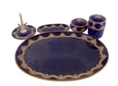 A Victorian five piece blue porcelain and enamel dressing table set.