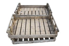 Four vintage wooden fruit crates.