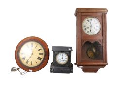 Two wall clocks and a mantel clock.