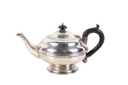 A George VI silver tea pot.