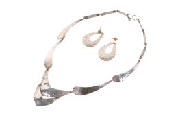 A silver necklace and earrings.
