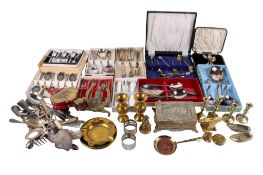A group of assorted silverplated flatware and brass.
