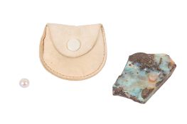 A section of rough boulder opal and a greyish-white pearl, undrilled.