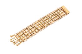 A Chinese yellow metal wide bracelet.