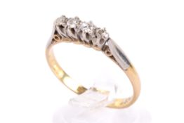 A yellow metal and diamond ring.