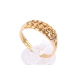 An 18ct gold ring. With 'braided' centrepiece, hallmarked to shank. Misshapen size S, weight 5.5g.