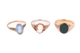 Three gold and yellow metal rings.