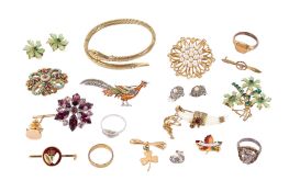 A small group of costume jewellery. Including a yellow metal snake bangle, brooches, rings, etc.