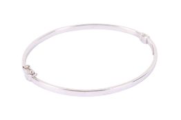 A 9ct white gold bangle by IBB, London.