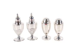 Two pairs of late 19th/early 20th century silver pepper pots.
