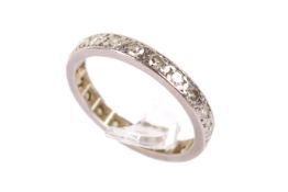 A white metal and diamond full eternity ring.