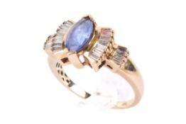 An 18ct gold sapphire and diamond dress ring.
